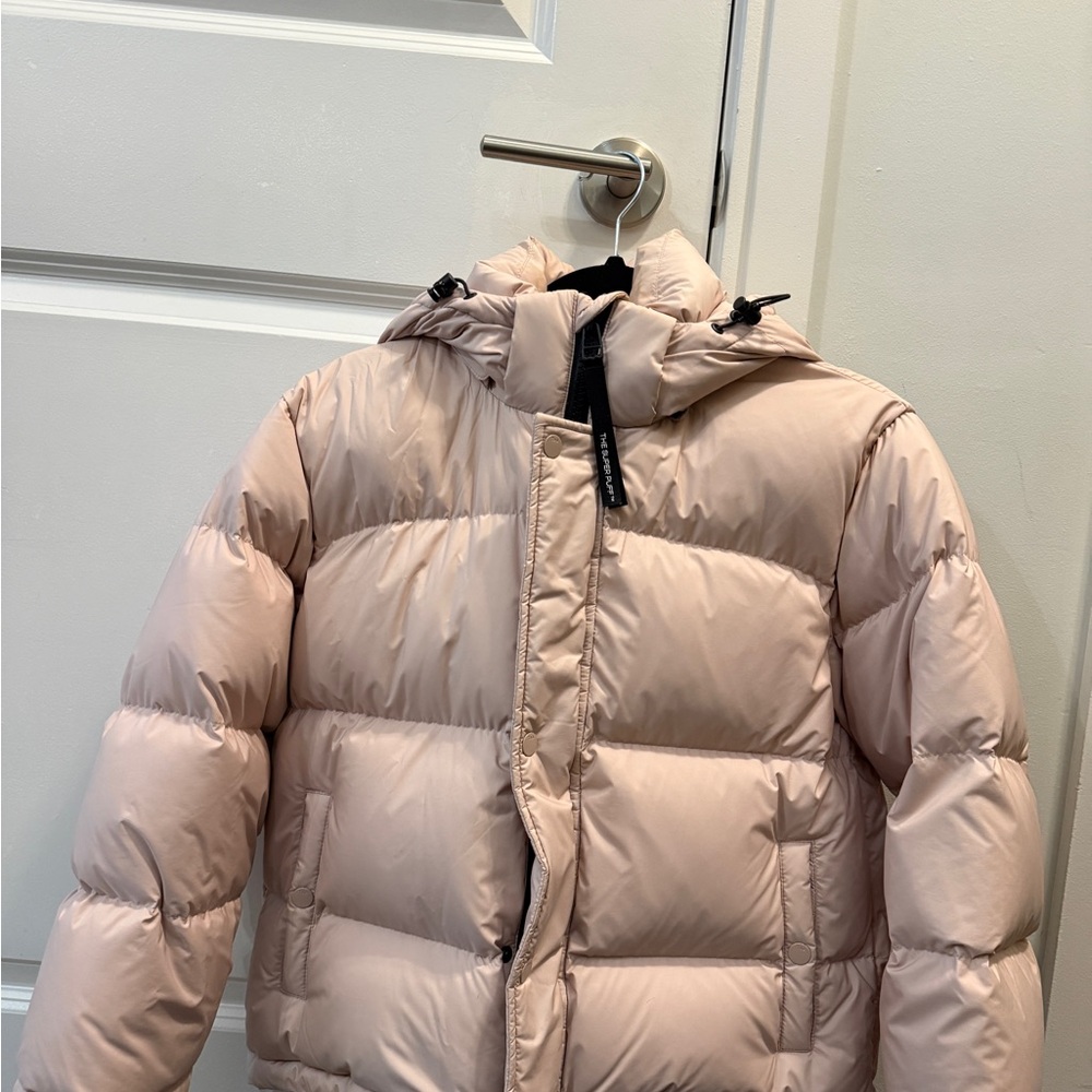 Stylish light pink Aritzia Super Puff Jacket